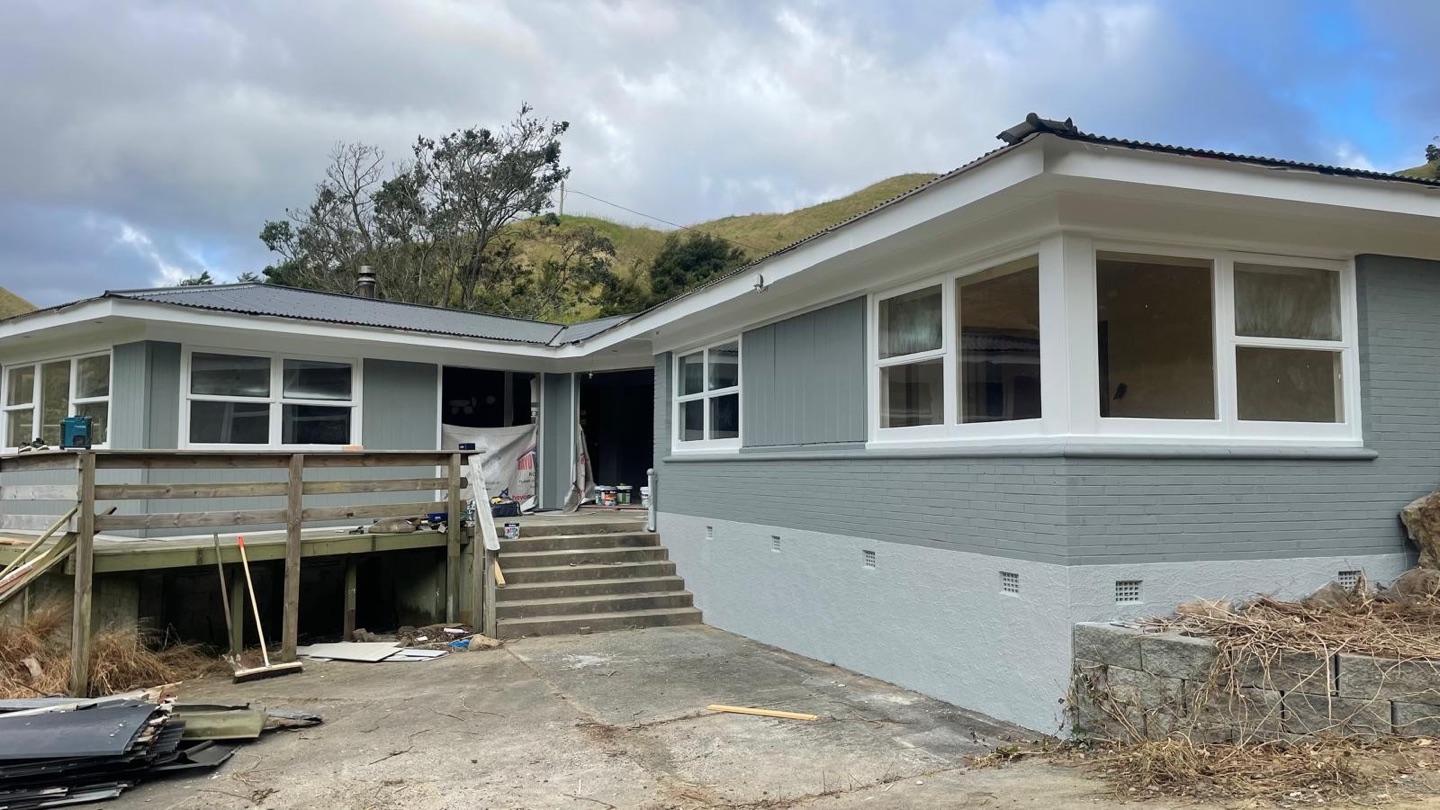 Auckland home after exterior painting with coordinated grey and white finishes