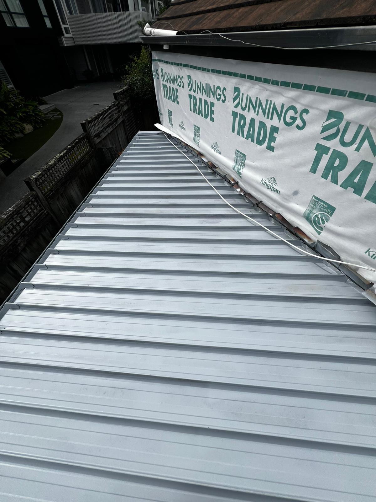 Second view of the restored and recoated metal roof